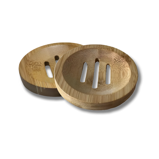 Round bamboo shampoo bar drainer dish with a smooth, natural wood finish, featuring slotted grooves for drainage. Designed to hold shampoo or conditioner bars and keep them dry between uses.