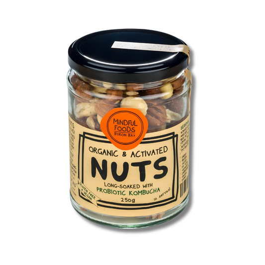 A glass jar of Mindful Foods Organic & Activated Nuts, featuring a beige label and a black lid, filled with mixed nuts and shown on a white background.