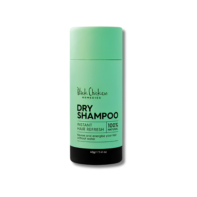 Green bottle of Black Chicken Remedies dry shampoo on a white background