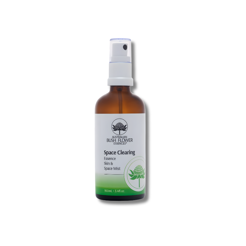 Brown spray bottle labeled 'Space Clearing' on a white background