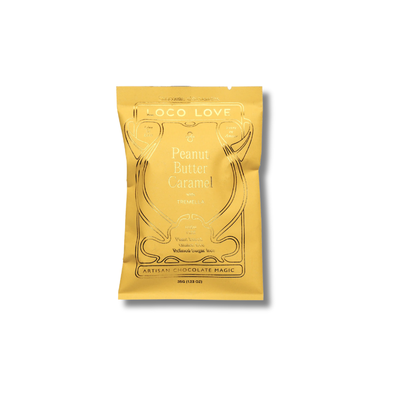 A gold foil pouch of Loco Love Peanut Butter Caramel chocolate, shown on a clean white background with a soft drop shadow.