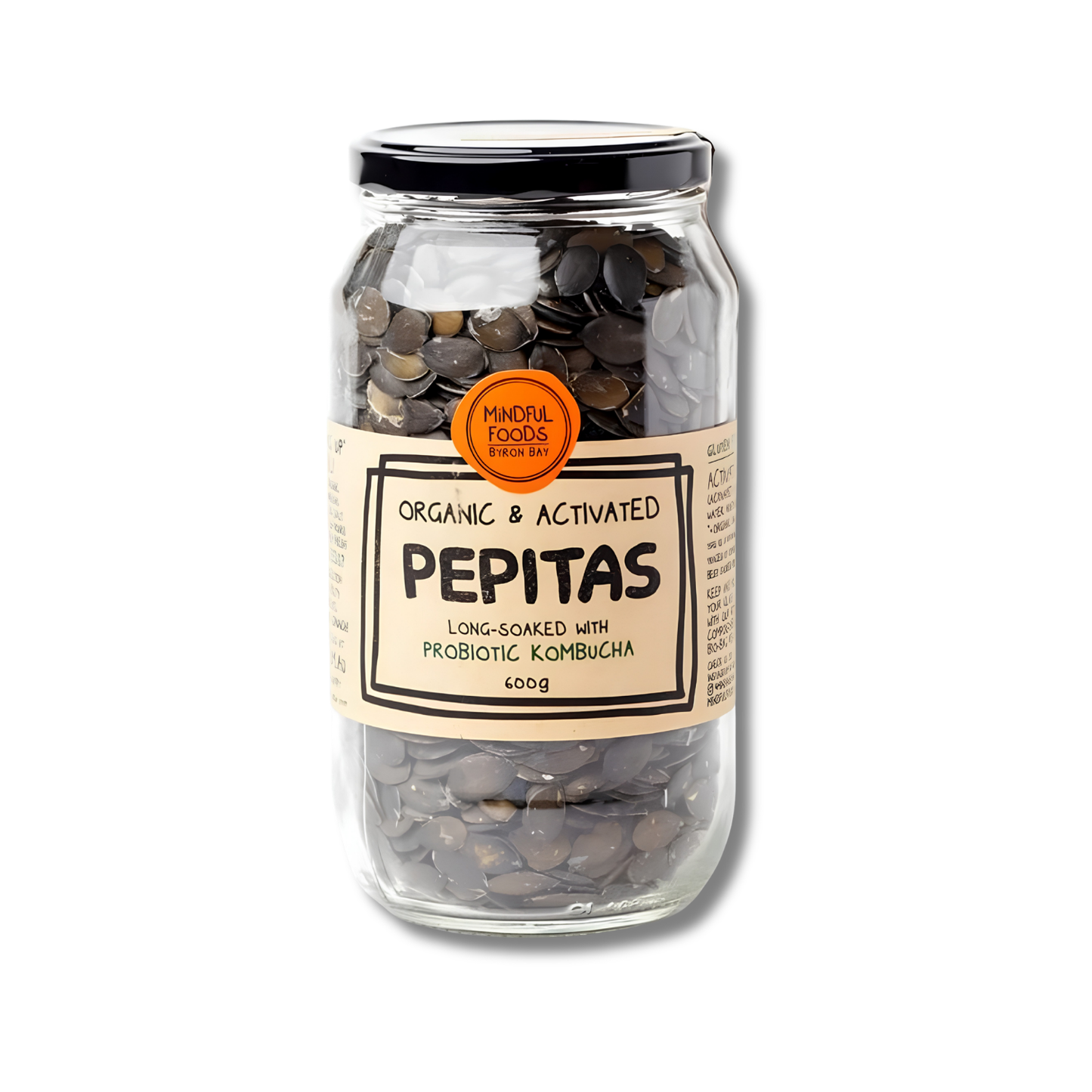 A glass jar of Pepitas long-soaked with probiotic kombucha, featuring a beige label with black text and an orange circular badge, sealed with a black lid on a white background.