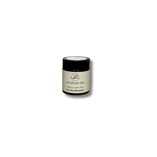 Small jar with a black lid on a white background