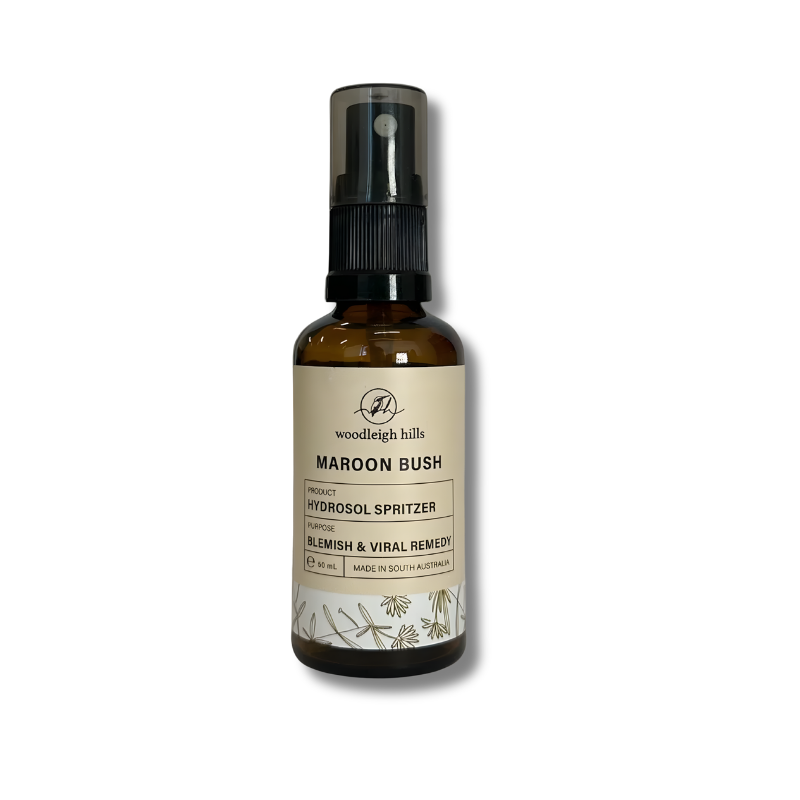 Brown spray bottle labeled 'Woodleigh Hills Maroon Bush Hydrosol Spritzer' on a white background