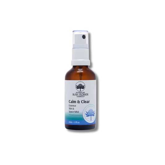 Bottle of 'Calm & Clear' essential oil spray on a white background