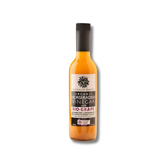 Bottle of organic horseradish vinegar with bio-grape flavor on a white background