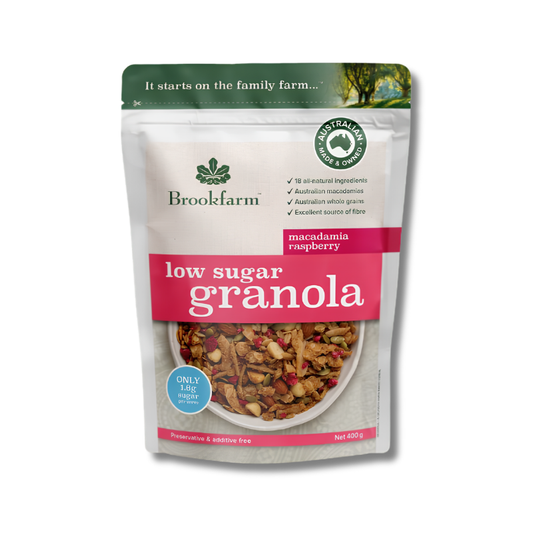 Package of Brookfarm low sugar granola with macadamia raspberry flavor on a white background