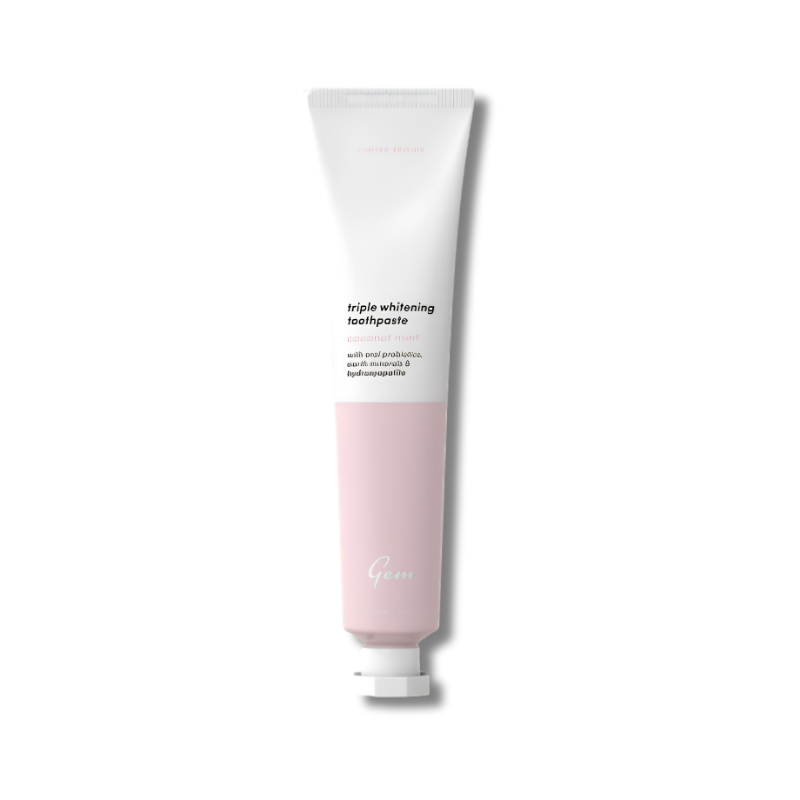 Tube of toothpaste with white cap on a white background