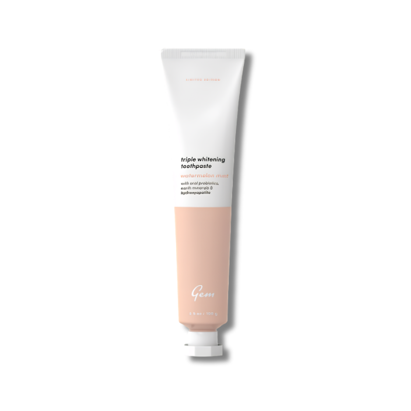 Tube of Gem toothpaste on a white background