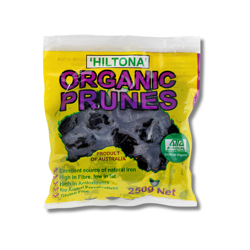 A bag of Hiltona Organic Prunes, 250g Net, featuring a bright yellow packaging with purple text and a photo of dark purple prunes on the front.
