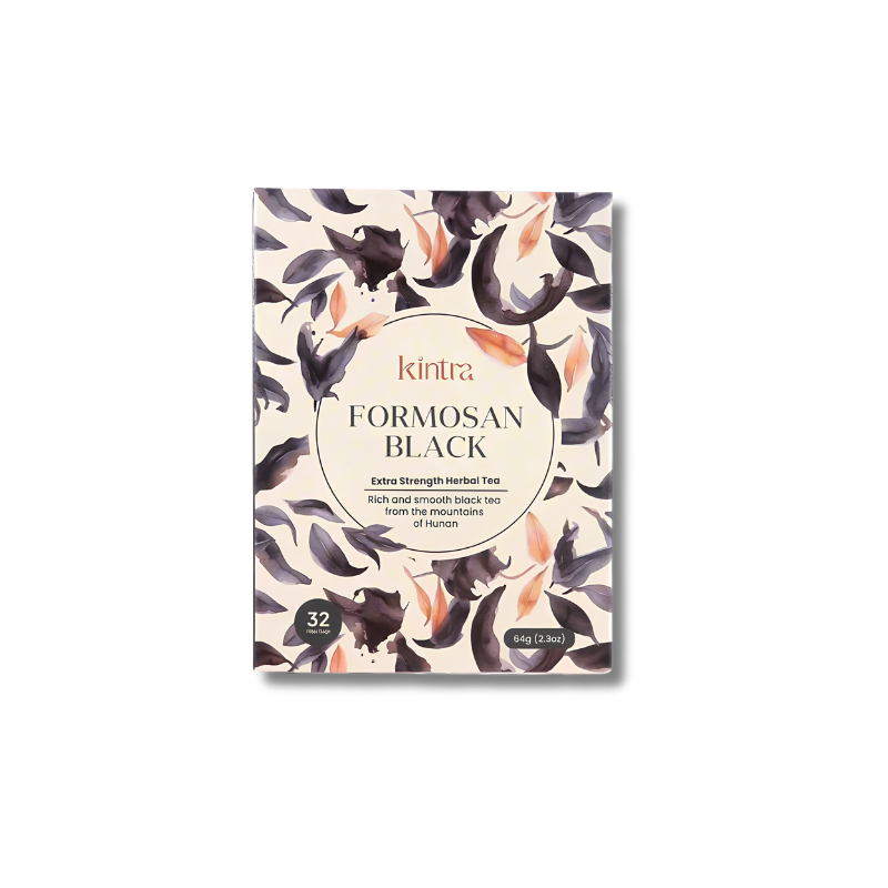 Kintra Formosan Black herbal tea packaging box, featuring a cream-colored background with a watercolor pattern of black and purple lotus flowers and peach-colored petals. The center has a circular beige label with the brand name 'kintra' and product name 'FORMOSAN BLACK'.