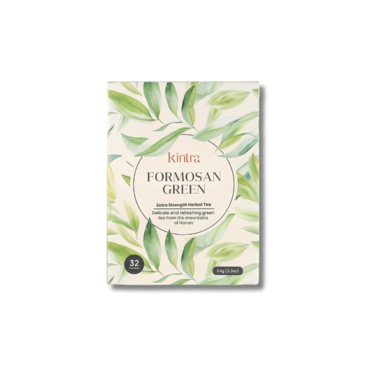 Kintra Formosan Green herbal tea box with a cream background, green leaf illustrations, and a central oval label, shown on a plain white background.
