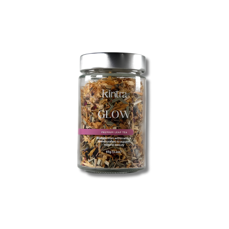 A clear glass jar of Kintra GLOW loose Leaf Tea with a silver lid, shown on a white background with a soft drop shadow.