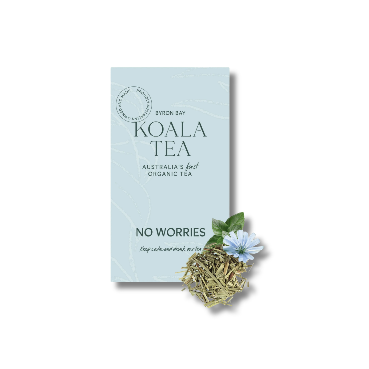 A package of Byron Bay Koala Tea, 'No Worries' variety, shown on a clean white background with a small cluster of dried tea leaves and a blue flower in front of the box.