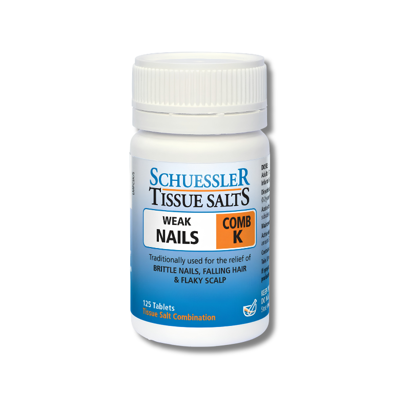 Schuessler Tissue Salts bottle for weak nails and comb K on a white background