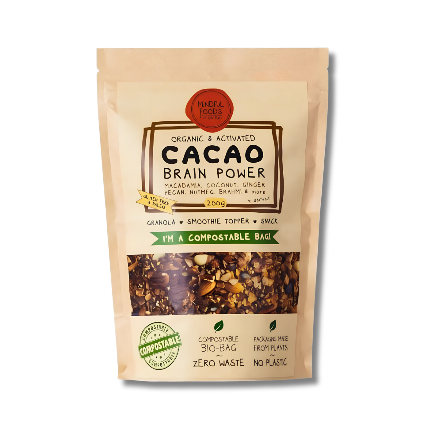 A stand-up pouch of Whole Foods Cacao Brain Power granola, smoothie topper, and snack mix. The packaging is a light beige compostable bag with a clear window showing the brown and beige granola inside.