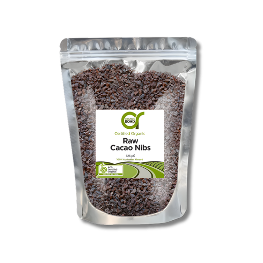 Packaging of raw cacao nibs with a visible brand label on a white background