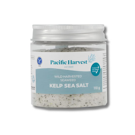 A jar of Pacific Harvest Wild Harvested Seaweed Kelp Sea Salt, 110g, in a clear plastic jar with a white and light blue label and a silver lid, shown on a white background.