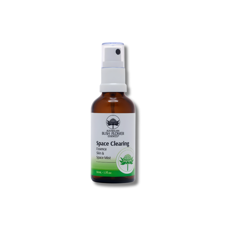 Brown spray bottle labeled 'Space Clearing' on a white background