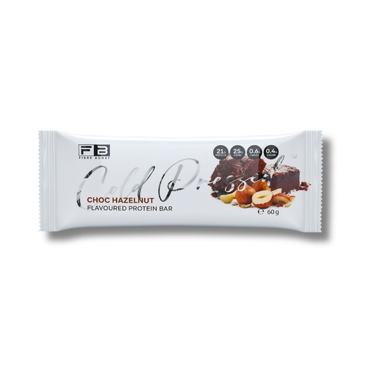 A single wrapped protein bar on a plain white background. The wrapper is white with black and brown text, showing the brand FB Mini Bars and the flavor Choc Hazelnut, along with a chocolate and nut illustration.