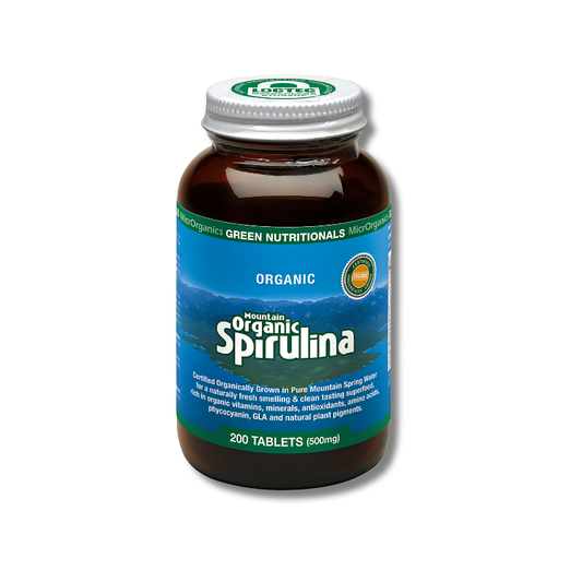 A bottle of Organic Spirulina tablets by MicroOrganics, featuring a blue label and a white cap, set against a plain white background.