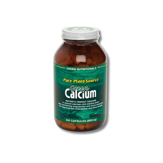 A bottle of Green Calcium dietary supplement capsules on a plain white background. The amber glass bottle has a green label with yellow and white text, and a white cap.