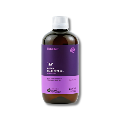 A 250ml amber glass bottle of Lab Shifa TQ+ Organic Black Seed Oil with a purple label and white cap, shown on a white background.
