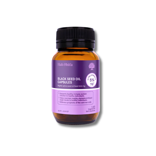 A bottle of Hab-Shifa Black Seed Oil Capsules on a white background. The product is in an amber glass bottle with a black ribbed cap and a purple label.