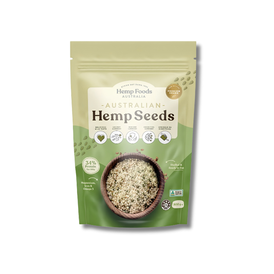A stand-up pouch of Hemp Foods Australia Australian Hemp Seeds, featuring a light green and olive green design with a bowl of hemp seeds on the front, set against a plain white background.