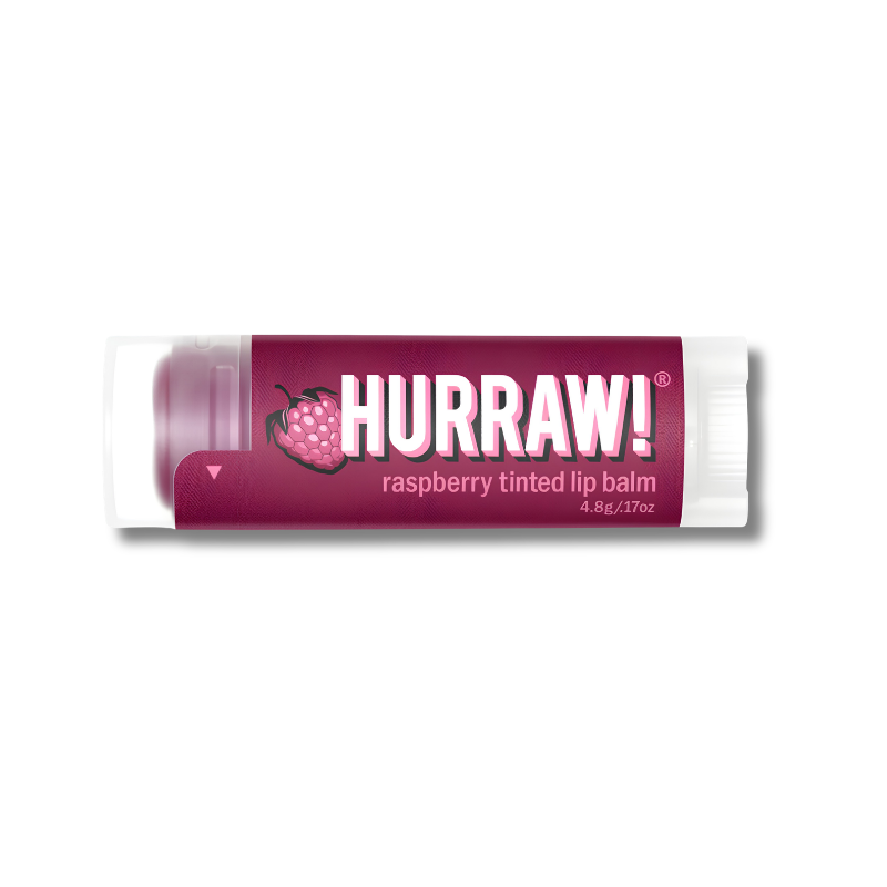 A tube of Hurraw! Raspberry Tinted Lip Balm with a dark magenta label and white cap, shown on a plain white background.
