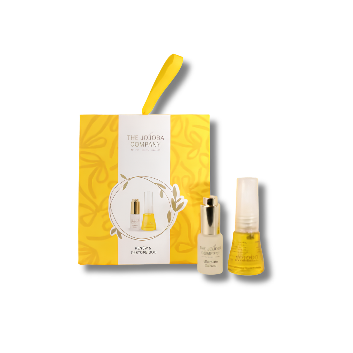 The Jodba Company Beauty Set featuring a yellow and white gift box with a carrying loop, alongside two small cosmetic bottles containing yellow liquid with gold caps, on a white background.