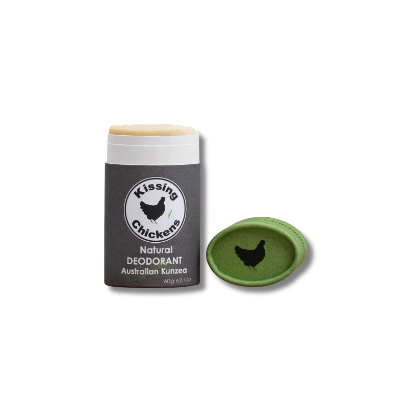 A stick of Kissing Chickens Natural Deodorant Australian Kunzea shown with its dark gray wrapper and a separate green lid on a white background.