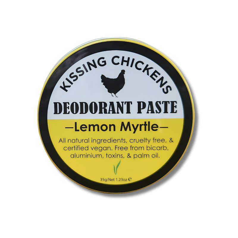 A round tin of Kissing Chickens Deodorant Paste in Lemon Myrtle scent, featuring a black, yellow, and white label with a black chicken silhouette.