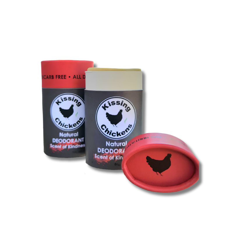 Two cylindrical deodorant containers labeled 'Kissing Chickens' with a red lid placed in front on a white background.