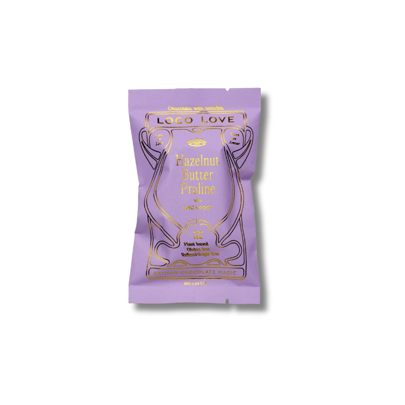 A single stand-up pouch of Loco Love Hazelnut Butter Praline flavor, featuring a light purple design with gold foil lettering and illustration, set against a plain white background.