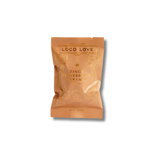 A stand-up pouch of Loco Love Gingerbread Caramel in the Zingy variant, featuring a metallic copper-orange background with gold foil text and decorative line art, set against a plain white background.