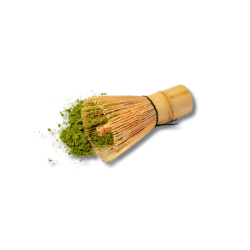 Bamboo whisk with matcha powder on a white background