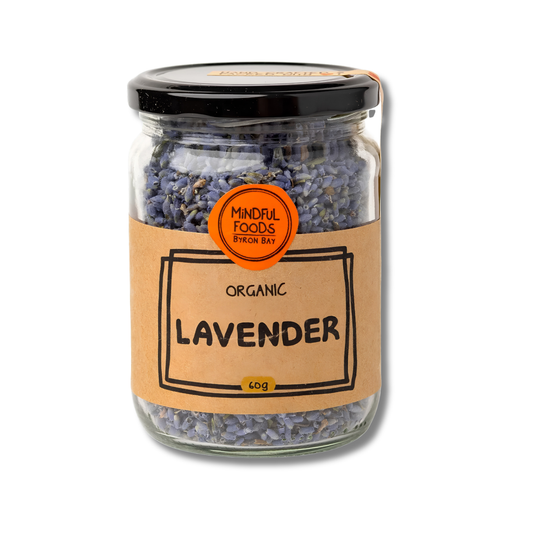 A glass jar of organic lavender with a kraft paper label and a black lid, on a white background.