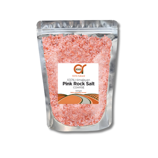 Pink rock salt packaging with a visible brand label on a white background