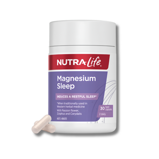 A white bottle of Nutra-Life Magnesium Sleep capsules with two beige tablets in front, set against a clean white background.