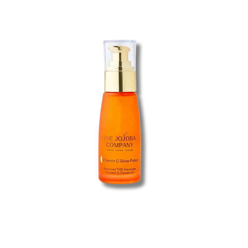 The Jojoba Company Vitamin C Glow Potion in an orange bottle with a gold pump and clear cap, centered on a white background.