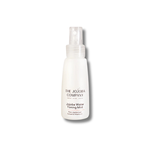 A white spray bottle of The Jojoba Company Jjoba Water Toning Mist on a clean white background.