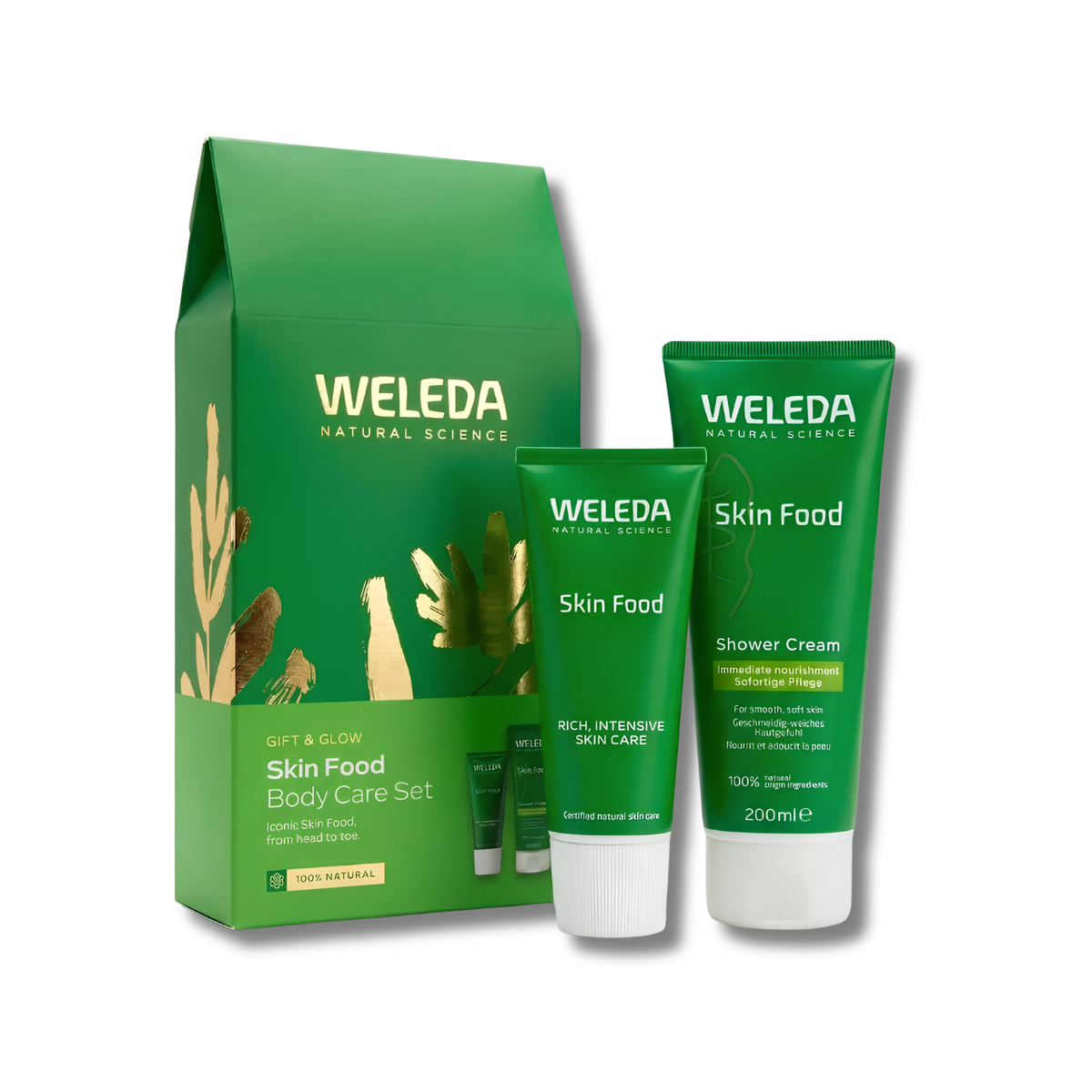 Weleda Natural Science Gift & Glow Skin Food Body Care Set, featuring a green gift box, a green Skin Food tube, and a green Shower Cream tube with white caps, on a white background.