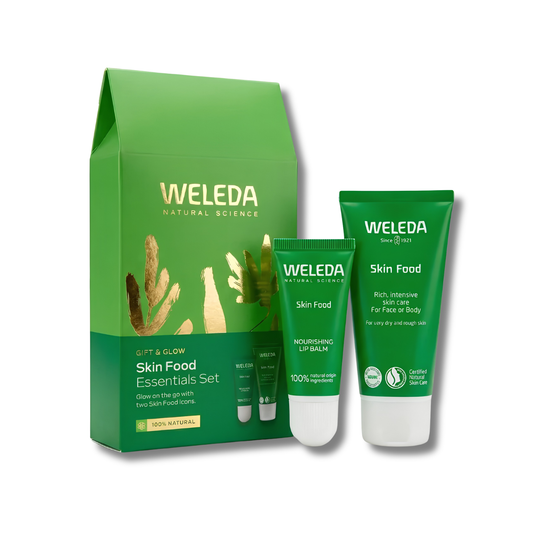 Weleda Skin Food Essentials Set featuring a green pouch and two green tubes of skincare products on a white background.